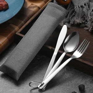 Portable stainless steel cutlery set for camping with grey mesh storage bag for travel