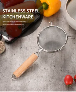 Fine mesh stainless steel strainer with ergonomic wooden handle and dual pot ears.