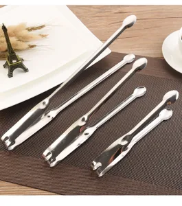 Close-up detail showing three sizes of professional stainless steel seafood and food tongs.