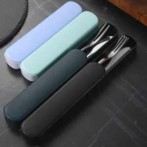 Portable 304 stainless steel fruit fork and knife set with colorful storage cases.