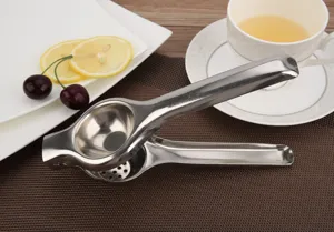 Premium durable stainless steel manual lemon squeezer displayed in a home kitchen scene