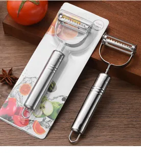 Detail of stainless steel vegetable peeler with retail packaging and ergonomic handle