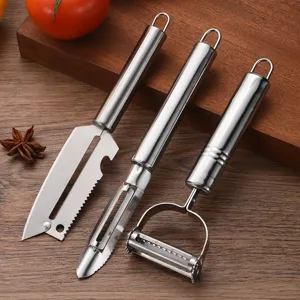 3-piece set of premium stainless steel vegetable and fruit peelers on a wooden board