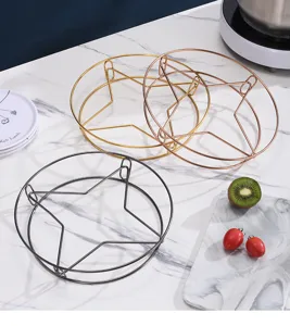 Set aus drei sternförmigen Edelstahldämpfgestellen in Gold, Roségold und Schwarz