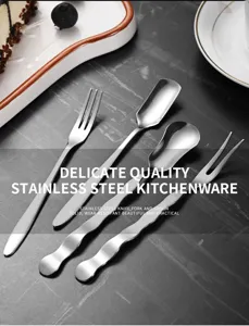 Close-up of elegant stainless steel cutlery set with unique wavy-shaped handles
