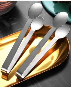 Close-up view of premium 304 stainless steel serrated ice tongs displayed on a golden tray