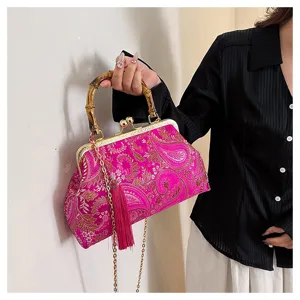 Elegante pinkfarbene bestickte Abendtasche mit Bambusgriff und Seidenquastendetail