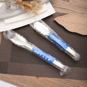Durable stainless steel food tongs with scalloped head for BBQ and serving steak