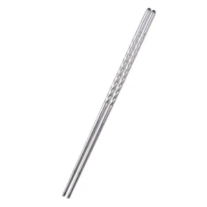 Reusable stainless steel chopsticks with anti-slip spiral handle design on white background