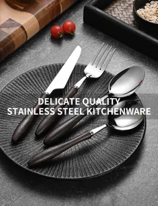Close-up detail of vintage stainless steel cutlery set with dark wooden handles