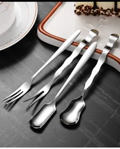 Macro view showing the unique wave handle design of stainless steel dessert forks and spoons