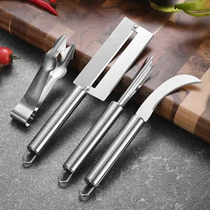 4pcs stainless steel pineapple peeler and fruit eye remover tool set on wooden board