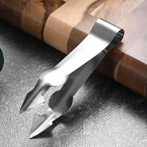 Professional stainless steel pineapple eye remover tool for kitchen use on wooden board