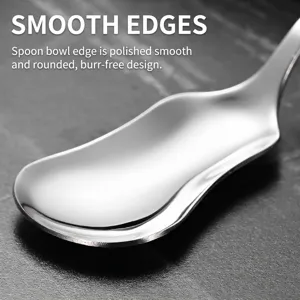 Polished stainless steel dessert spoon featuring a unique wavy edge design for snacks.