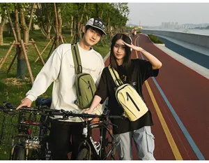 Lifestyle shot of outdoor nylon sling bags for couples during a cycling activity.