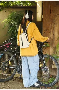 Outdoor cream nylon chest bag for cycling and daily commuting shown in real-life use