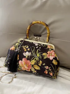 Sac à main brodé de fleurs vintage avec poignée en bambou et bandoulière à glands.