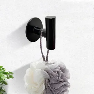 Black metal wall mounted robe hook bathroom towel holder close up detail view storage