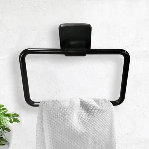 Detailed view of the black bathroom towel ring mounted on white wall with a soft towel.