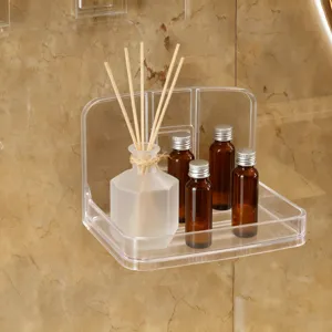 Detail showing a transparent wall-mounted bathroom shelf for holding bottles and jars.