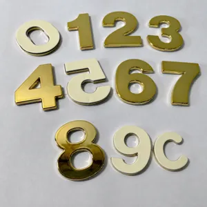 Gold ABS plastic house numbers detail view, shiny chrome finish numerals 0 to 9 for hotel doors.
