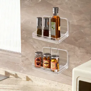 Modern transparent wall-mounted acrylic shelves holding kitchen spice jars and olive oil