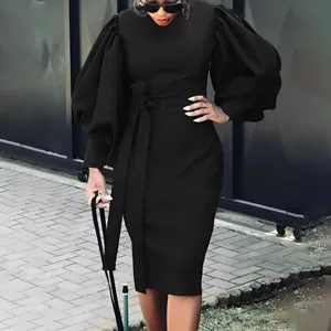 Black plus size midi dress featuring chic puff sleeves and a flattering waist tie belt for women.
