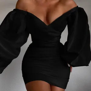 Stunning black off-shoulder bodycon dress with dramatic puff sleeves for elegant evening wear.