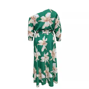 Green floral one-shoulder plus size dress detail view, elegant asymmetric neckline and belt.