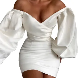 White off-shoulder puff sleeve bodycon mini dress detail showing elegant texture and fit.