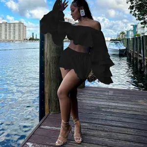 Black off-shoulder ruffle long sleeve top and mini skirt two-piece set for women stylish.