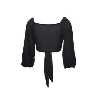 Black long sleeve crop top detail showing the square neckline and front tie closure design.