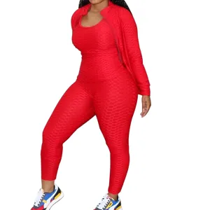 Women red honeycomb athletic 3-piece tracksuit detail view showing jacket and leggings.