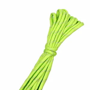 Close-up detail shot of neon green reflective paracord, 4mm 7-strand utility rope 10m bundle.