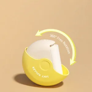 Portable mini lint roller with 360-degree rotating shell design for daily clothing use.