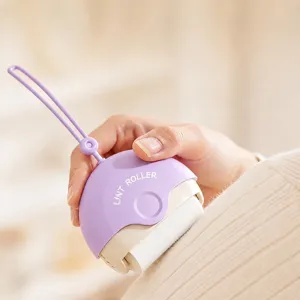Portable mini lint roller for pet hair and clothes dust removal with convenient lanyard design.
