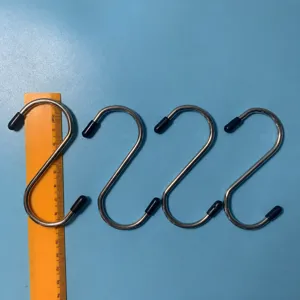 Stainless steel S-shaped hanging hooks with protective rubber caps for kitchen and bathroom.