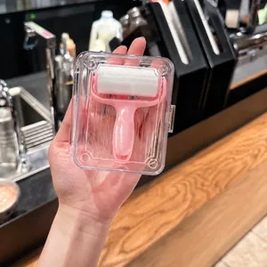 Portable mini lint roller with transparent storage case, perfect for clothes and pet hair.