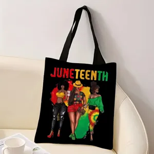 Vista detallada del bolso de lona negra con un estampado gráfico vibrante Juneteenth