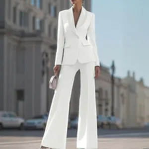 Elegant white two-piece blazer and wide-leg trouser suit for women street style view.