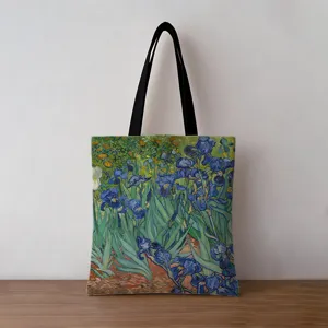 Vintage oil painting canvas tote bag featuring Van Gogh's Irises on a wooden surface.