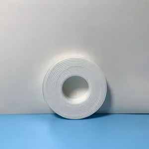 High viscosity white foam double-sided tape roll for strong adhesive mounting and crafting.