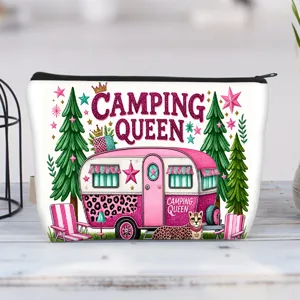 Detailed view of canvas makeup bag with 'Camping Queen' pink trailer print
