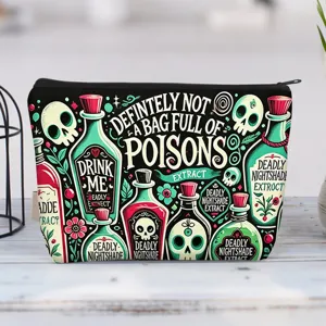 Close-up detail of gothic canvas makeup bag featuring unique poison bottle and skull designs