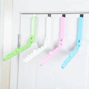 Travel folding clothes hanger over door drying rack with 5 holes for home indoor use.