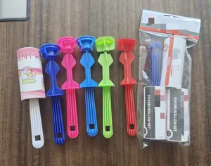 Lint roller sticky dust remover set with multi-color handles and replacement rolls for clothes.
