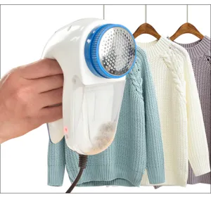 Electric lint remover plug-in fabric shaver for clothes fuzz pellet remover and trimmer.