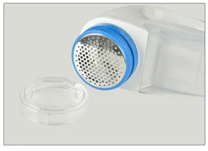 Electric lint remover with stainless steel mesh and clear cover for clothes care.