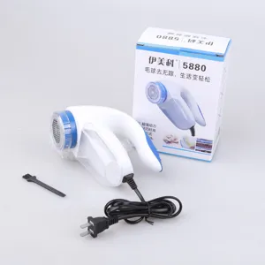 Electric lint remover for clothes, fabric shaver with plug, fuzz remover with clear container.