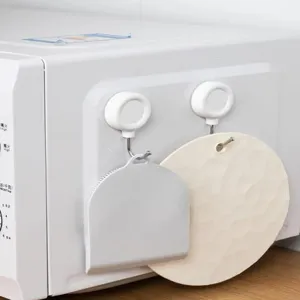 Dettaglio gancio magnetico forte, base magnetica rotonda bianca con gancio in acciaio per cucina.